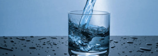 Clear water poured into a glass for a TDS meter check