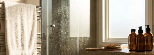 U.S. bathroom shower and hair care setup with clear water theme
